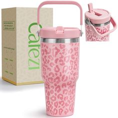 thermos cup with handle is pink and has a leopard print pattern on it