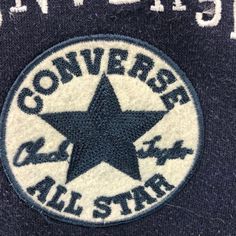 the converse all star logo is shown in white and black on a dark blue background