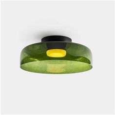 a green and yellow light hanging from the ceiling