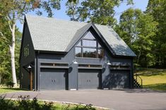 a house with two garages in front of it