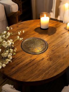 a wooden table with some candles on it