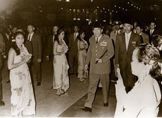 an old black and white photo of people dancing