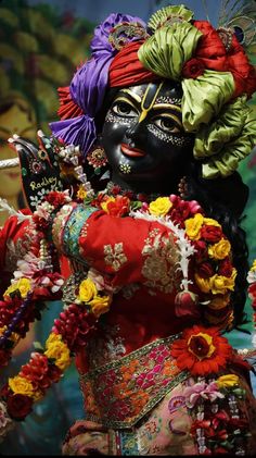 a woman dressed in an elaborately decorated costume