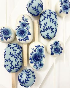 some blue and white lollipops sitting on top of each other in front of an instagram