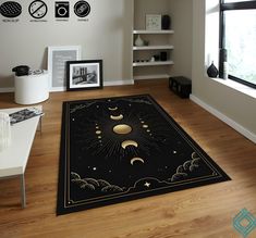 an area rug with the sun and moon on it in front of a large window