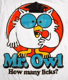 a white t - shirt with an owl wearing a cap and gown on it's head