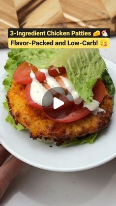 chicken patties with tomatoes, lettuce and mayonnaise on a white plate