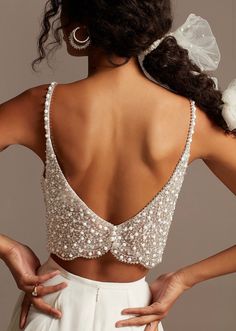 the back of a woman wearing a wedding dress