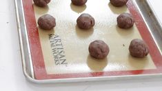 chocolate cookies are on a baking sheet ready to go into the oven