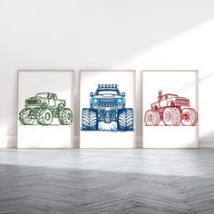 three framed art prints depicting four different types of vehicles on the wall in an empty room