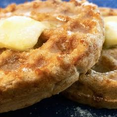 two waffles with bananas are on a blue plate