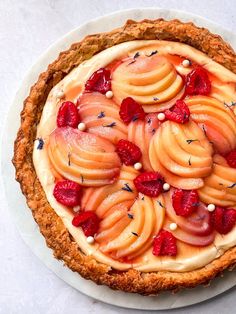 there is a pie with fruit on it