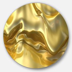 a gold colored circular object with wavy lines on the top and bottom, as well as an abstract design