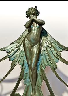 a statue of a woman with wings on it's back