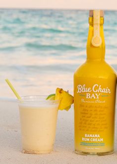 a bottle of blue chair bay rum next to a drink