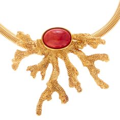 The Cove Necklace epitomizes oceanside elegance with its design inspired by the natural beauty of Costa Rican sea coral. Made with a thick cobra snake chain and large, 24K gold-plated coral pendant, a captivating coral red resin stone at its center adds a touch of fiery allure. All jewelry is handcrafted and made to order in our New York City design studio. Please allow 7-14 business days for production from the order date. Measurements: 15 1/2" L with 3" extension and 3" pendant drop Statement Gold Necklace, Beachy Necklace, Cobra Snake, Resin Stone, The Cove, Coral Pendant, Sea Coral, Costa Rican, Gold Statement Necklace