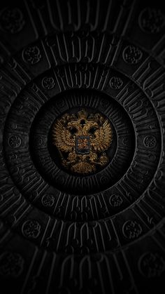 an image of a coat of arms in the center of a circular pattern on a black background