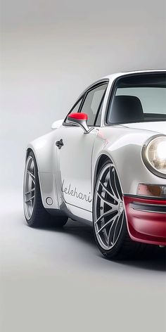 a white and red sports car on a gray background