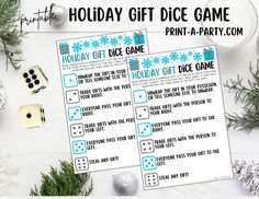 two printable holiday gift dice game cards next to christmas decorations