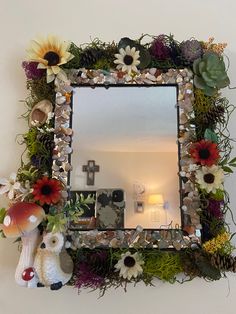 a mirror that has some flowers on it