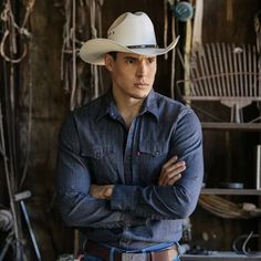 man wearing brown belt with silver belt buckle and demin shirt with white bangora straw vented cowboy stampede hat with genuine brown leather trim Hot Cowboy