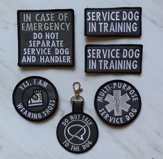 four patches with words on them that say, in case of emergency do not separate service dog and handler