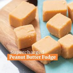 several pieces of peanut butter fudge on a cutting board with the words, super charged peanut butter fudge