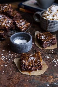 chocolate brownies with caramel drizzled on top and other dessert items