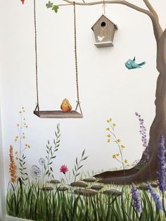 there is a mural on the wall of a room with birds and flowers painted on it