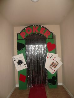 an entrance to a casino themed party with poker cards and playing cards on the door