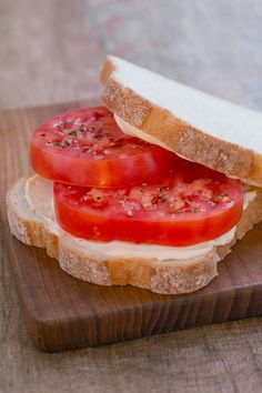 two slices of bread with tomatoes and cheese on them