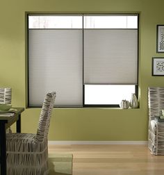 a dining room with chairs, table and window blinds in shades on the windowsill