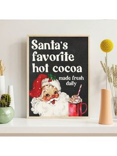 santa's favorite hot cocoa made fresh daily on a shelf next to potted plants