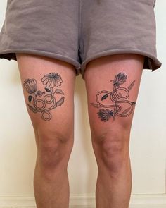 the legs of a person with tattoos on them