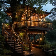 a tree house with lights on the porch and stairs leading up to it's second story