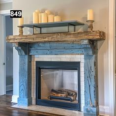 a fireplace with candles on top of it