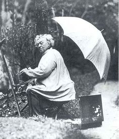 an old man sitting on a bench with an umbrella over his head, holding a painting palette