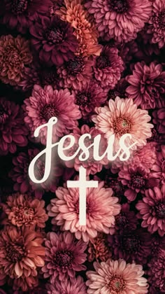 flowers with the word jesus on it and a cross in the middle, against a dark background