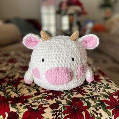 a crocheted stuffed animal sitting on top of a couch