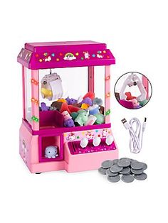 a pink toy machine with lots of stuffed animals in it's display case next to some coins