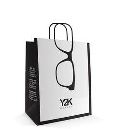 a black and white shopping bag with sunglasses on it