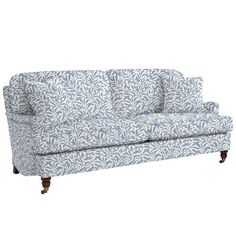 a blue and white couch sitting on top of a wooden frame