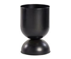 a black cup sitting on top of a metal stand