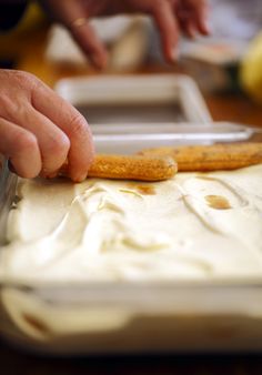 a person cutting some food with a knife