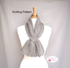 DOWNLOADABLE knitting pattern - Vinelle Scarf This elegant keyhole scarf is a gorgeous neck warmer or accent scarf, adding a lovely touch of class. Stunning worn alone with a top or dress, or just tucked into your coat or worn with an open-front sweater... Design features a fern lace stitch in a sport weight yarn for a comfortable, light drape. Construction: Scarf is worked from end to end, separated for the keyhole opening, re-joined and continued to the end. Size: 6"/15cm wide, 22"/56cm neck, 38.5"/98cm total length Yarn: 2 skeins Cascade Yarns 220 Superwash Sport  (136yds/124m, 50g/1.75oz, 100% merino wool)  Shown in #219 Moon Rock Needles: US 5 (3.75mm) or size to obtain gauge  Spare double point needles in same or smaller size, stitch holder or waste yarn Gauge: 22 sts and 32 rows = 4 Knitted Neck Warmer Free Pattern, Madame Defarge, Knitted Neck Warmer, Infinity Scarf Knitting Pattern, Easy Scarf Knitting Patterns, Keyhole Scarf, Scarf Knitting Pattern, Cable Scarf, Cable Knitting Patterns