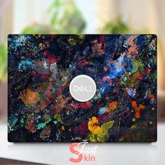 an image of a laptop that has been painted with acrylic paint on it