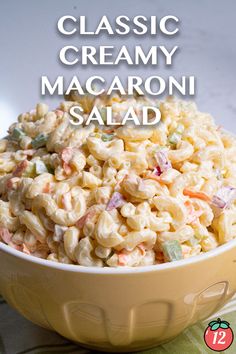 macaroni salad in a bowl with the words classic creamy macaroni salad