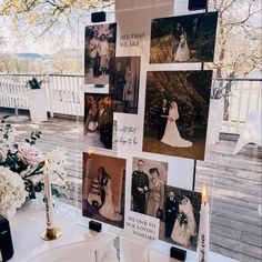 a table with pictures and candles on it in front of a window that says we are married