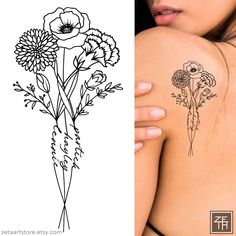 a woman's back with flowers on it and the same tattoo design as her upper arm