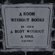 a room without books is like a body without a soul circo sign on brick wall